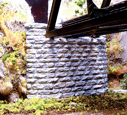 214-8460  -  Sngl Cut Stone Tprd Abut - HO Scale