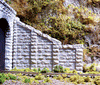 214-8402  -  Cut Stone Sloped Abtmt 2/ - HO Scale